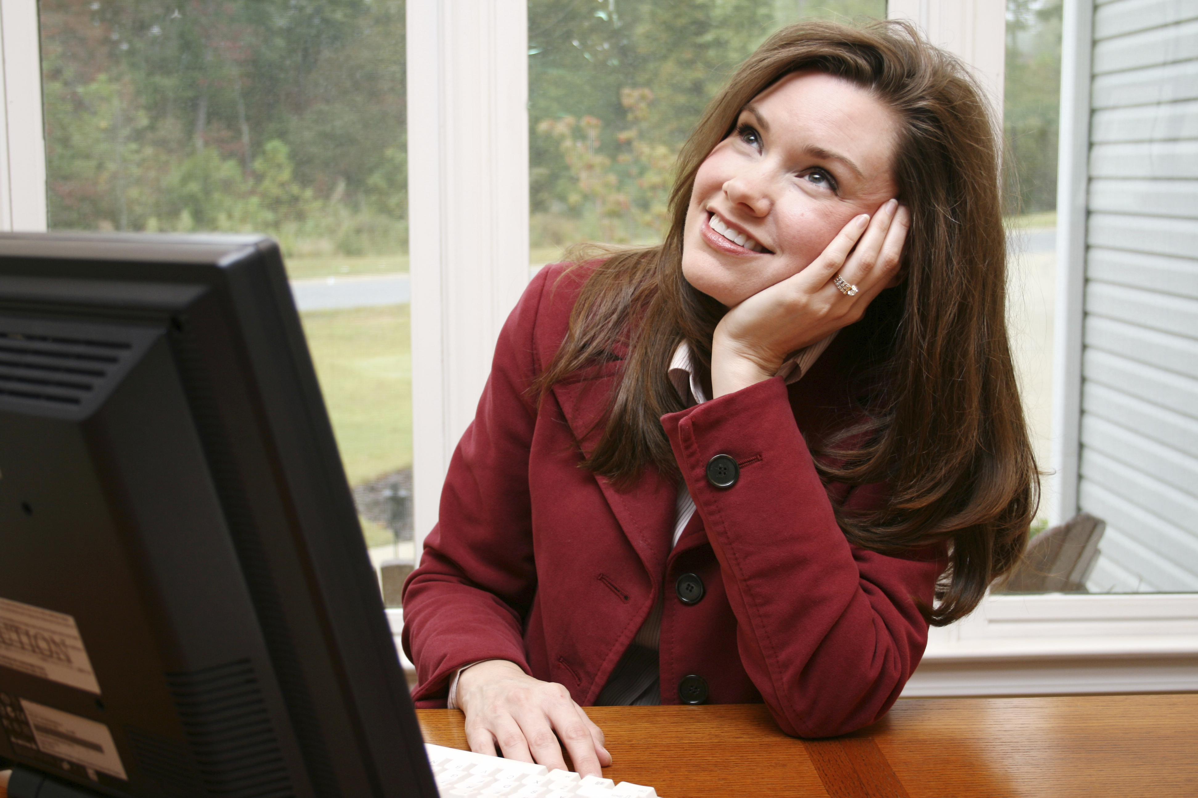 woman daydreaming at work