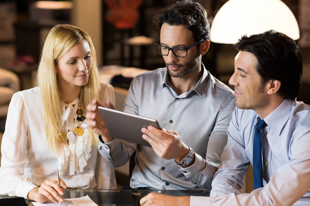 Workers in Canada check out the Lottoland site on a tablet. 